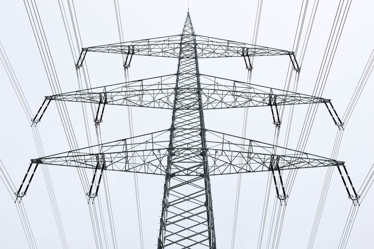  connections;day;electrical tower;electricity;energy;germany;low angle view;nobody;one object;outdoors;power concept;power line 