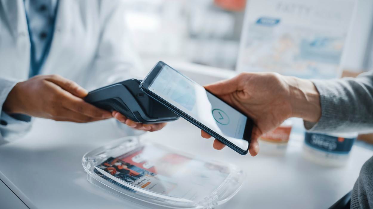  hand;phone;mobile;medication;pharmacy;drugstore;pharmacist;customer;medicine;e;business;client;cashless;device;money;transaction;digital;retail;wireless;smartphone;holding;application;software;app;payment;contactless;purchase;card;checkout;terminal;nfc;shopping;technology;counter;service;two;people;buy;drugs;shop;pharmaceutics;category_code_healthcare 