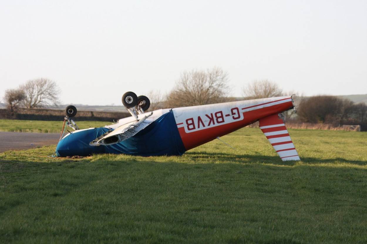  Airplane crash upside down plane airfield gale air;Airplane crash upside down plane airfield gale air wind aircraft air traffic pembrokeshire west Wales aerodrome field blown accident safety;NOT_EDITORIAL_ONLY 
